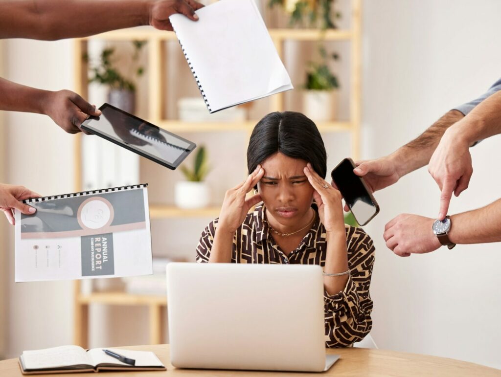 Woman business manager suffering of burnout, anxiety and stress at work in a corporate office by th